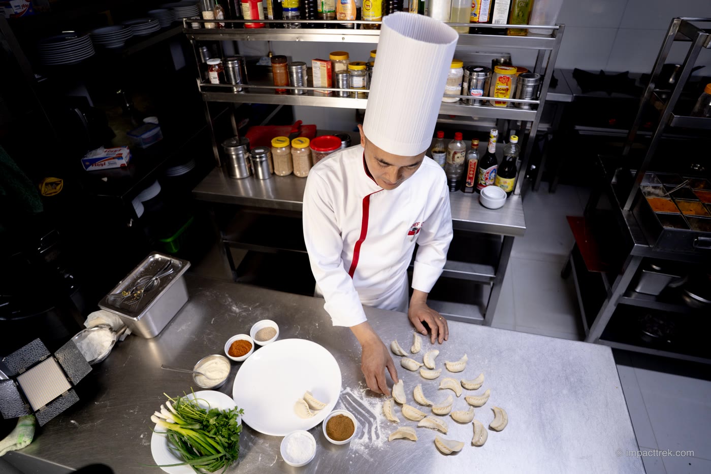 Chef Chhetra Shrestha shaping momo in his Kathmandu café kitchen